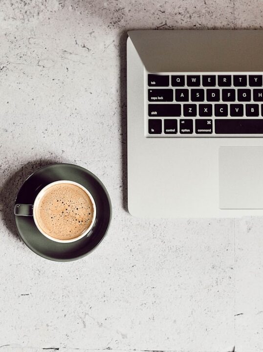 Photo by Liana Mikah cappuccino in teacup on saucer. it represents working on webdevelopment.